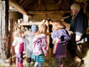 Children at Mary Arden’s Farm with one of the Guides, looking at the Heritage breed sheep, photo by Amy Murrell